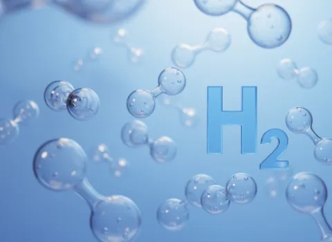 Symbolbild mit Wasserstoff-Molekülen vor blauem Hintergrund.